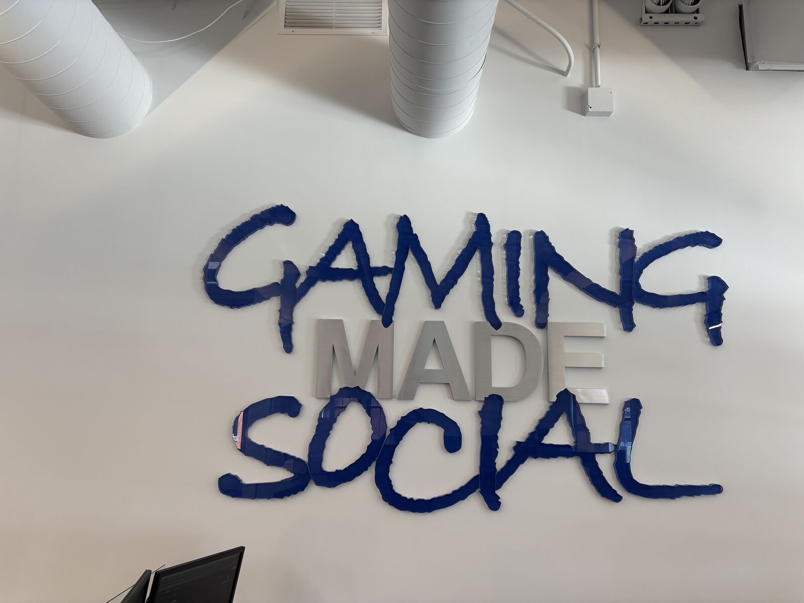 'Gaming Made Social' wall art at the Trivelta office